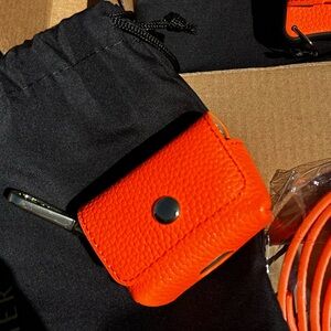 Brand New Bandolier Avery AirPod Pouch Case Neon Orange with gold metal clip